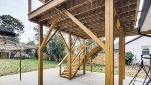 A wooden deck structure with a staircase leading to an upper level. - 6 Mi to Spectrum Center: Spacious Getaway w/ Deck (Charlotte)