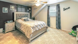 A bedroom with a bed, nightstand, and a ceiling fan. - 6 Mi to Salisbury: Forest-view Sanctuary! (Parsonsburg)
