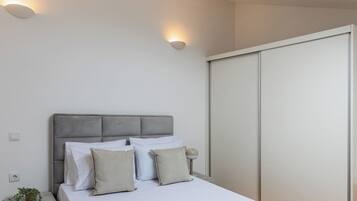 1 bedroom, desk, iron/ironing board, travel crib