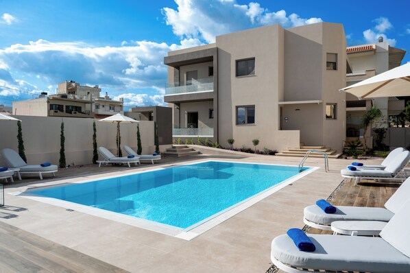 Outdoor pool, pool umbrellas, pool loungers