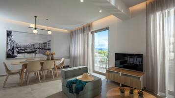 Luxury Apartment, 2 Bedrooms, Garden View | Living area | 32-inch Smart TV with cable channels