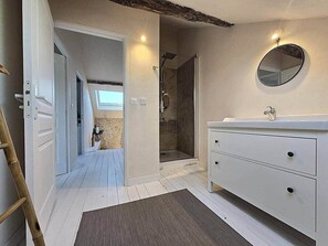 Shower, hair dryer, towels, toilet paper
