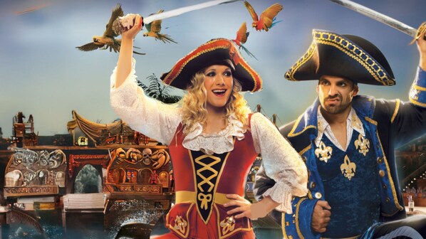 A pirate-themed scene with a ship, a pirate, and a parrot.