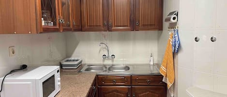 Microwave, stovetop, coffee/tea maker, electric kettle