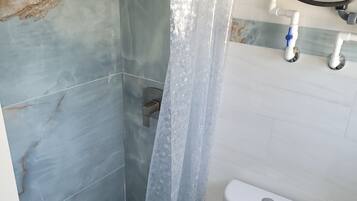 Shower, towels, soap, toilet paper