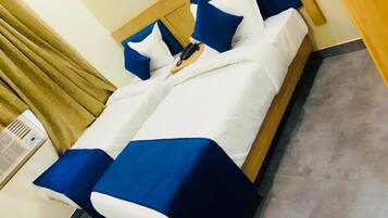 Premium bedding, down duvets, memory-foam beds, in-room safe