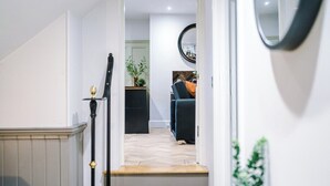 A modern interior with a staircase leading to a living area. - Charming 2-bedroom Flat in York - Sleeps 6 (York)