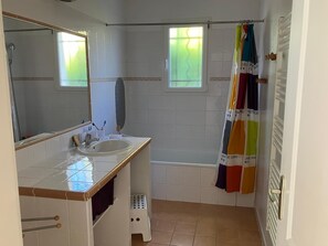 Shower, hair dryer, towels, toilet paper