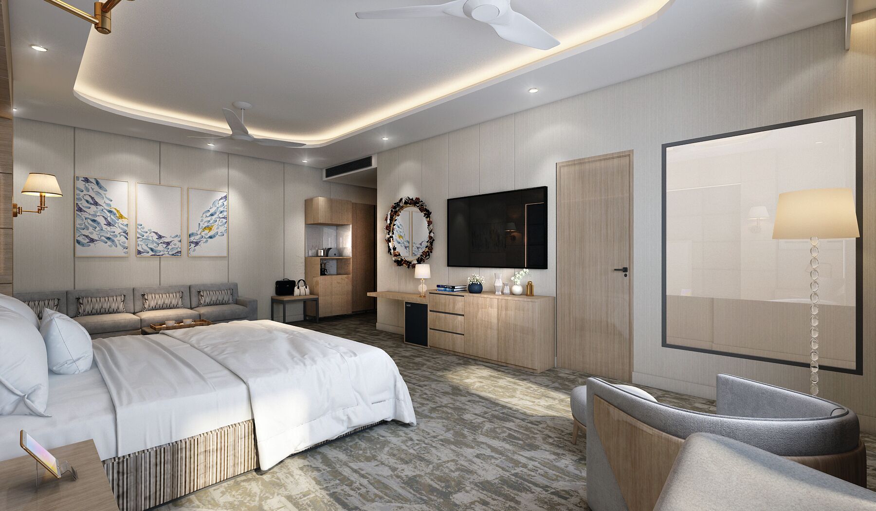 A modern hotel room with a large bed, a sitting area, a kitchenette, and a TV mounted on the wall.