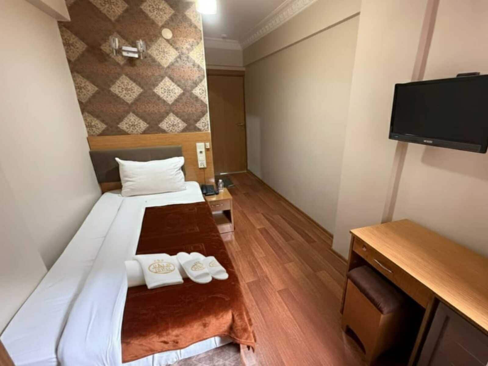 Economy-enkeltværelse | Premium-sengetøj, minibar, lydisolering, gratis Wi-Fi