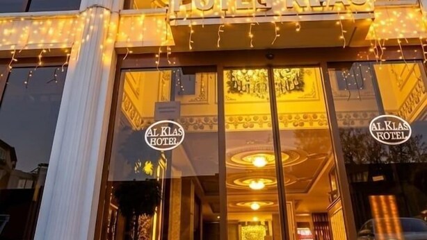 A hotel with a classic facade, multiple windows, and a red carpet entrance. - Alklas Hotel (Istanbul)