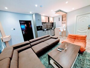 Comfort Room | Desk, laptop workspace, blackout drapes, iron/ironing board - Condos De La ChiChi (Kumasi)