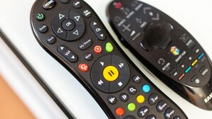 Two remote controls with various buttons and symbols. - The Westfield, comfortable 2 bedroom apartment that sleeps 4 (Edinburgh)
