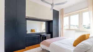 A bedroom with a bed, a ceiling fan, a window with curtains, and a dresser. - Spacious Villa with Pool, BBQ and Tennis Courts (Lazio)