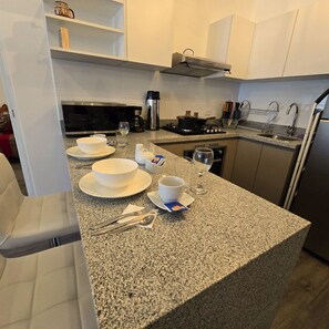 Microwave, oven, coffee/tea maker, cookware/dishes/utensils