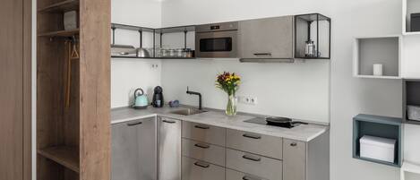 Fridge, microwave, stovetop, coffee/tea maker