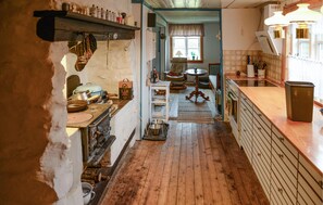 Fridge, stovetop, dishwasher, coffee/tea maker