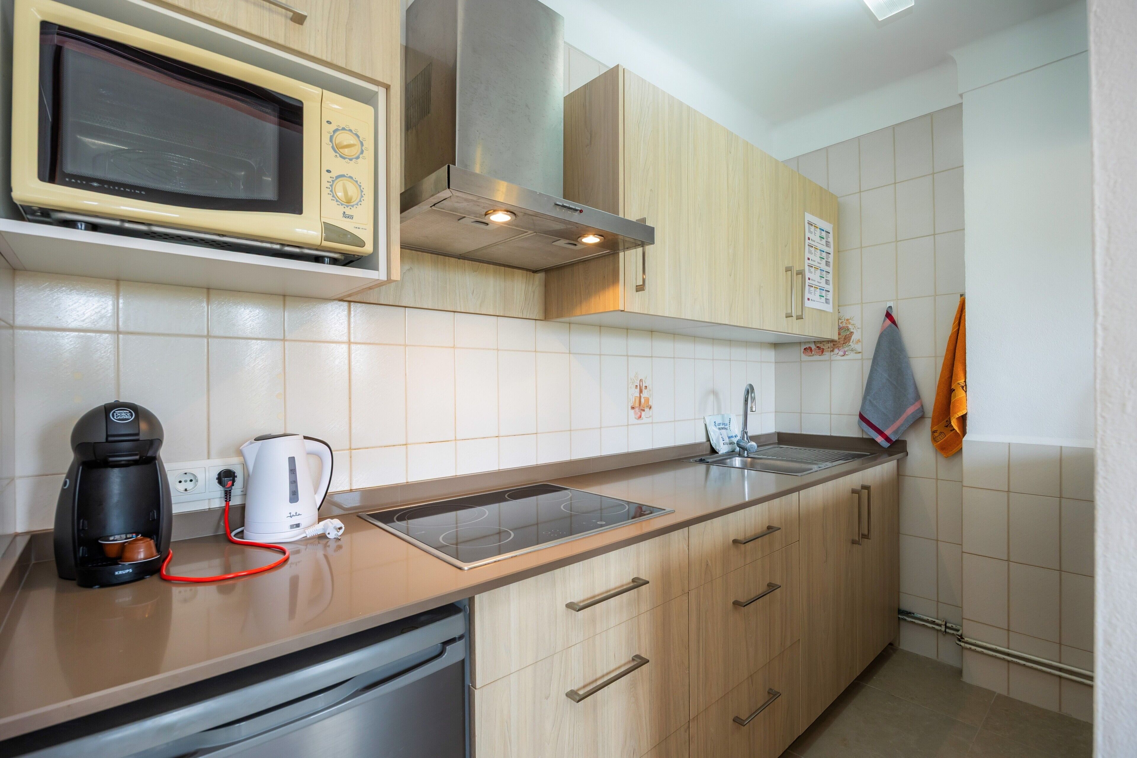 Fridge, microwave, stovetop, coffee/tea maker