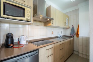 Fridge, microwave, stovetop, coffee/tea maker