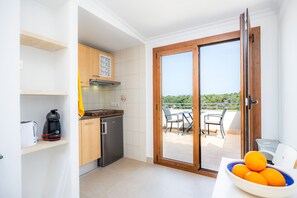Fridge, microwave, stovetop, coffee/tea maker