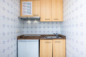 Fridge, stovetop, electric kettle, toaster