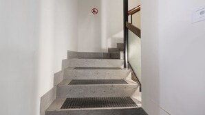 A staircase with a handrail and a no-smoking sign. - Apartment 'Marilleva 900 Kristall' with Mountain View, Shared Terrace and Wi-Fi (Mezzana)