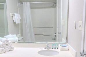 Shower, hair dryer, towels, shampoo