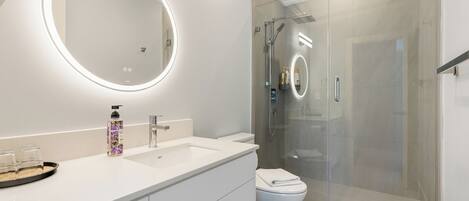 Shower, hair dryer, towels, soap