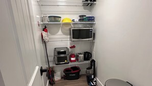 A compact kitchen with a microwave, toaster, coffee maker, and a trash bin. - Modern 1BR Retreat • Near Sugar House & Downtown (Salt Lake City)