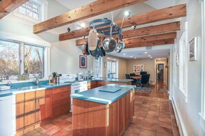 The airy kitchen offers ample space & all the comforts of home - 4 BDR w/ Private Hot tub, Backyard and Deck! (Wells)