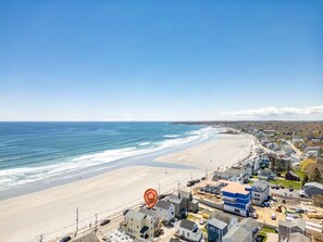 A coastal town with a beach, houses, and a construction site. - Beachfront | 20 Steps to Long Sands | Ocean Views (York)