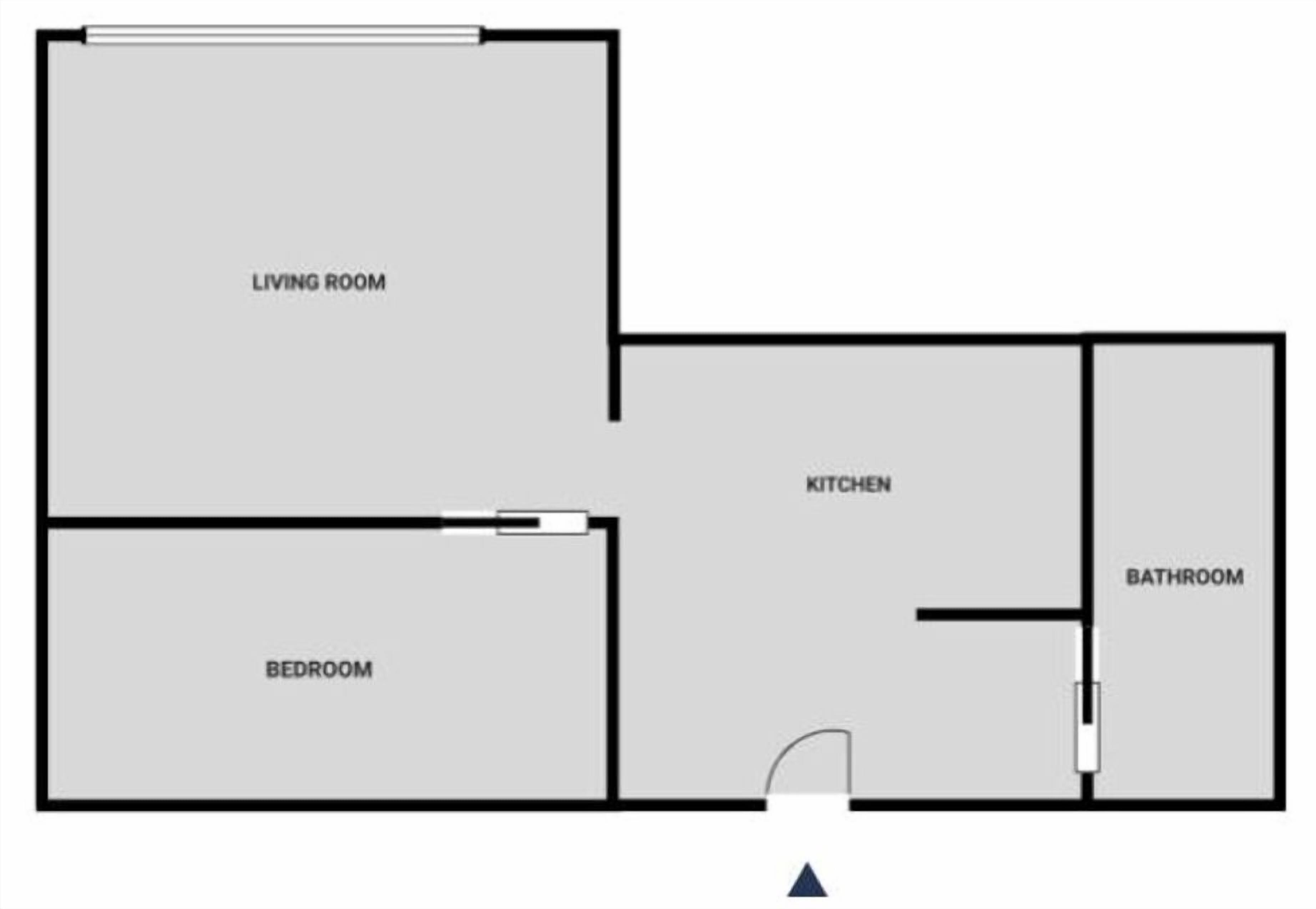 Plano de planta que muestra una sala de estar, cocina, baño y dormitorio.