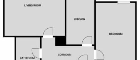 A floor plan with a living room, kitchen, bedroom, bathroom, and a corridor.
