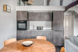 Enjoy cooking in this well-equipped kitchen with an oven and stainless steel sink.