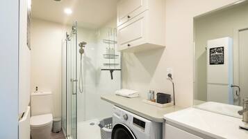 Shower, hair dryer, towels, soap