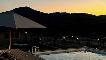 Seasonal outdoor pool, pool umbrellas, pool loungers