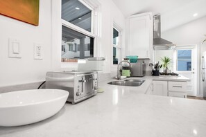 Fridge, microwave, stovetop, coffee/tea maker