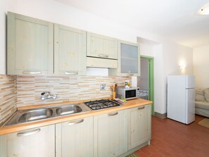 Fridge, microwave, cookware/dishes/utensils