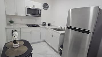 Fridge, microwave, stovetop, coffee/tea maker