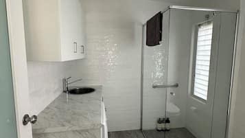 Shower, hair dryer, towels, soap