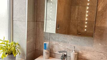 Hair dryer, towels, soap, shampoo