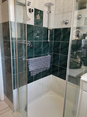 Shower, hair dryer, towels, soap