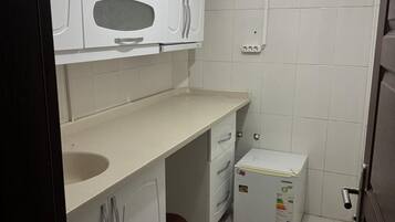 Basic Twin Room, City View | Private kitchen | Fridge