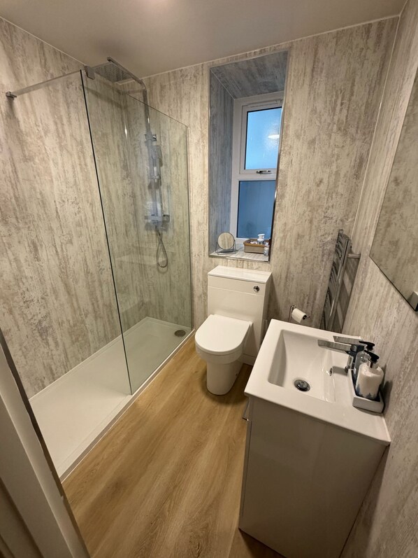 Shower, hair dryer, towels, soap