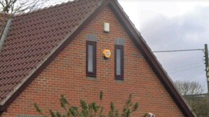 A brick building with a garage door labeled "PRIVATE PARKING 28 Abington Please Keep Clear." - Ouston Oasis, Beamish (Chester-le-Street)