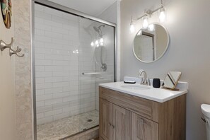 Shower, hair dryer, towels, soap