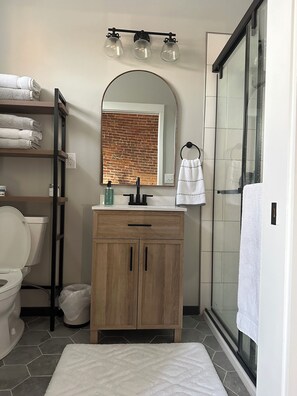 Shower, towels, soap, toilet paper