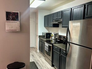 Fridge, microwave, oven, stovetop - Modern Serenity in Upper Marlboro - Luxe 2-Bed Condo with Alluring Amenities (Upper Marlboro)