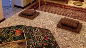 A room with a bed, a dresser, a chair, and a lamp. - Cozy apartment in historic country residence, between Perugia and Assisi (Perugia)