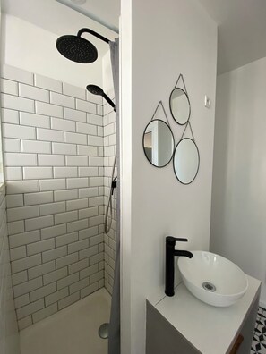 Shower, hair dryer, towels, toilet paper